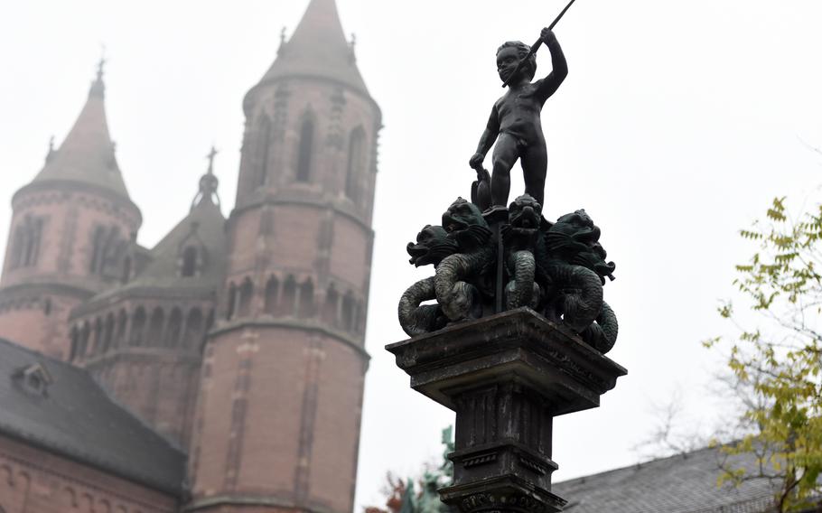 Statues and symbols of dragons can be found throughout the city of Worms, an old city in southwestern Germany on the Rhine River. This statue of a boy standing over dragons stands near St. Peter's Cathedral, one of three Romanesque churches in Germany.