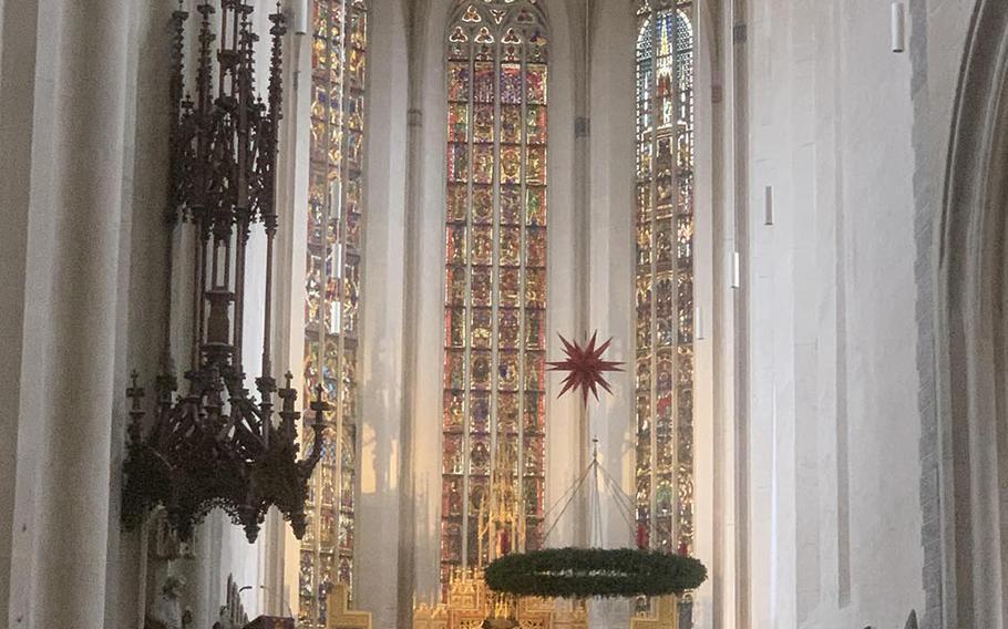 A view of the main altar, depicting the 12 apostles, inside St. James's Church in Rothenburg, Germany. The church was built over a 100-year period during the 14th and 15th centuries.