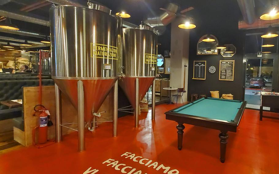 Doppio Malto's fermentation containers inside their new location adjacent to the Granfiume Gran Shopping mall in Fiume Veneto, Italy. Doppio Malto's award-winning craft beers are just one reason to stop by this restaurant and brewery.