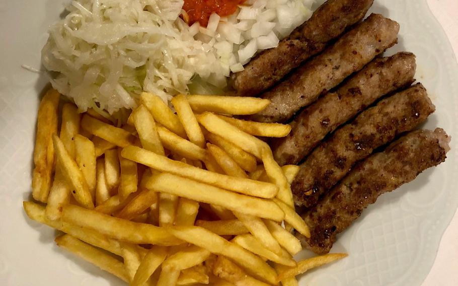 A plate of cevapcici, a favorite in several countries in southeast Europe, in Kaiserslautern's Balkan Grill restaurant.