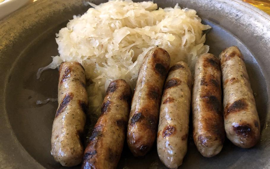 Bratwurst and sauerkraut, a Nuremberg specialty, are served at the restaurant Roeslein in the city's center.