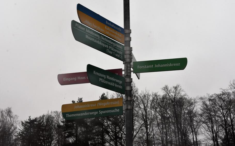 A sign outside the House of Sustainability in Johanniskreuz, Germany, points the way to a variety of outdoor adventures in the heart of the Palatinate Forest.