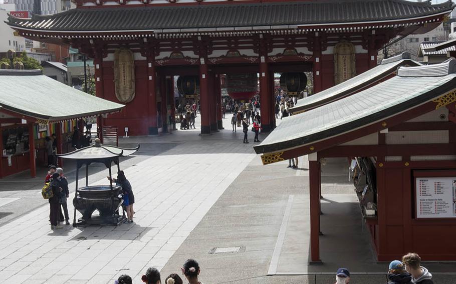 Visitors wearing traditional Japanese kimonos walk the ground of Sensoji, the oldest Buddhist temple in Tokyo, March 5, 2020.