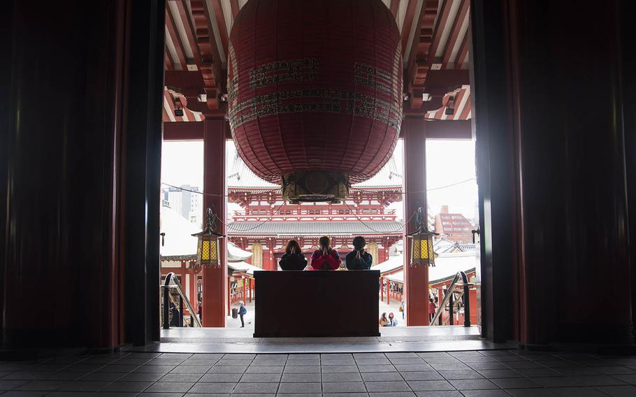 Visitors pray at Sensoji, the oldest Buddhist temple in Tokyo, March 5, 2020.