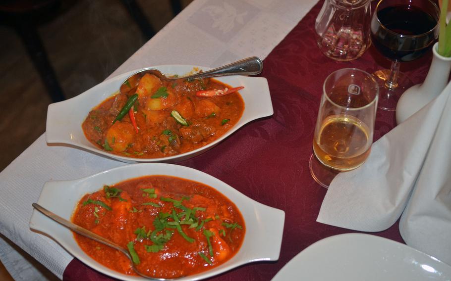 Indian Palace's chicken makhni, includes sliced chicken breast fried in butter and served in a mild tomato-based curry. Lamb karahi, top, has lamb pieces cooked with ginger and herbs, made in a karahi pan.