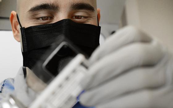 Tech. Sgt. Jordan Rigor, 48th Medical Support Squadron, conducts coronavirus testing at RAF Feltwell, England, April 9, 2020. Having the capability to test locally has reduced the wait time for results from 5 to 7 days to less than 24 hours. 

