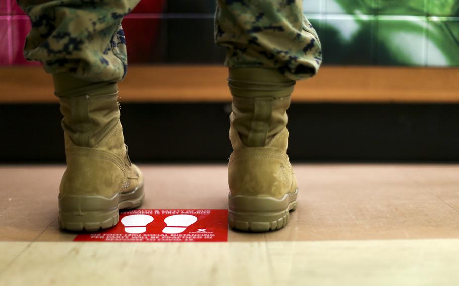 A floor decal reminds customers to practice social distancing at an exchange store at Camp Foster, Okinawa, March 31, 2020.