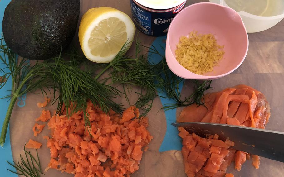 The ingredients for smoked salmon tartare: smoked salmon, avocado, creme fraiche, lemon zest and juice, and dill.