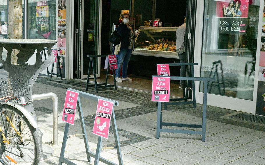 Signs outside the Palazzo Sandro ice cream shop in Kaiserslautern, Germany, count down to "ice cream time" - or when a customer will be first in line to be served - in increments of 1.5 meters, the distance people are supposed to keep between them and the next person under Germany's social distancing rules. 

