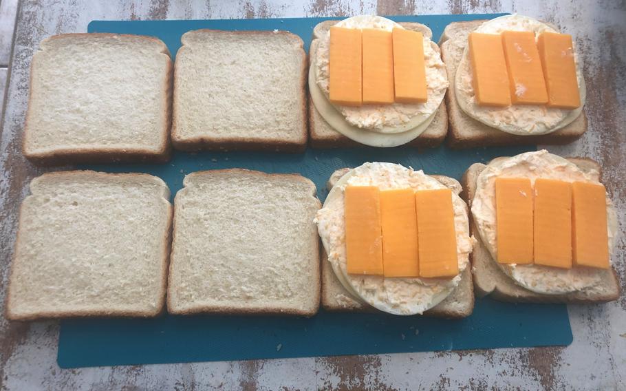 The Grilled Three-Cheese Sandwich is made in three steps: a cream cheese spread for inside the sandwich, a garlic spread for the outside of the bread and the final assembly of the sandwich.