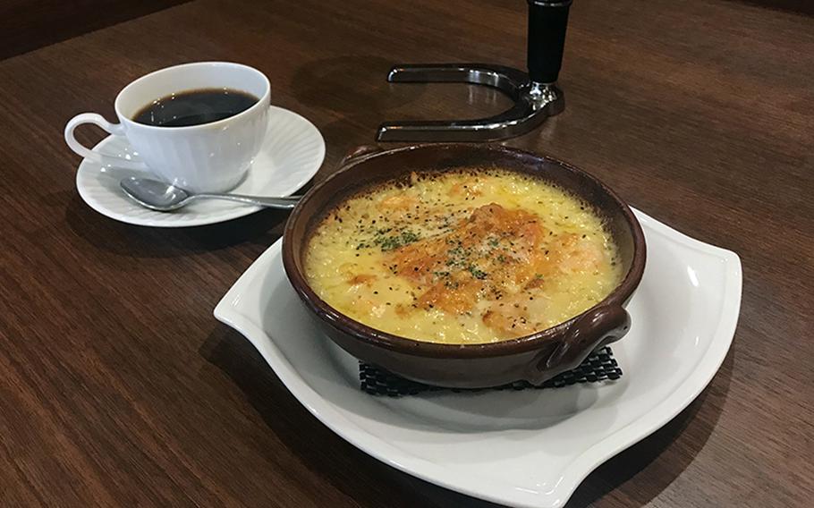 Kurashiki Coffee in Sasebo, Japan, offers more than just a great cup of coffee. This cheesy rice bowl topped with shrimp made for a delicious meal after being topped with red chili powder.