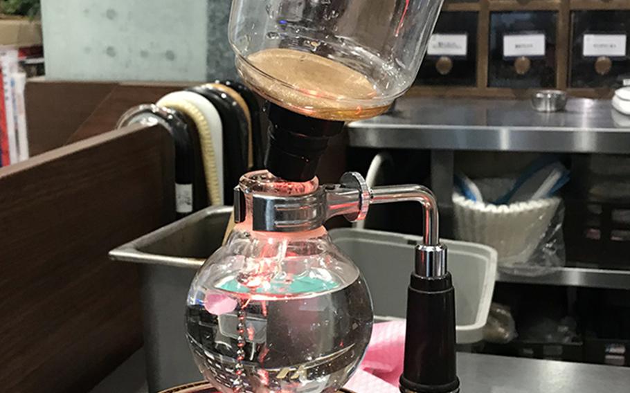 Kurashiki Coffee in Sasebo, Japan, uses a single-serve siphon brewer for its signature cup of joe.