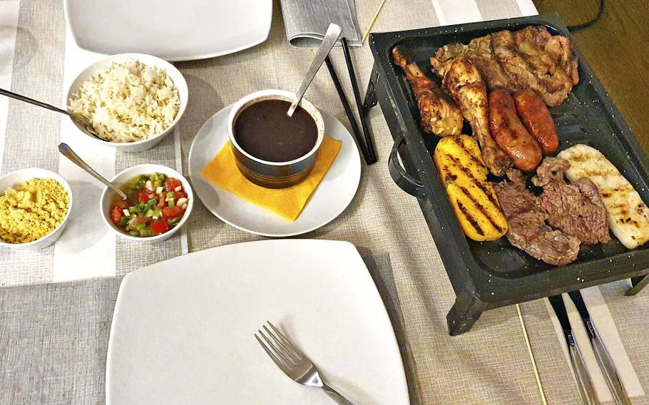 Boom Brasil's gran grigliata mista, which is a large mixed grill dish containing beef, a pork chop, two types of sausages, chicken drumsticks and fried polenta. The restaurant opened at the beginning of June and is located about 11 miles from Aviano Air Base.