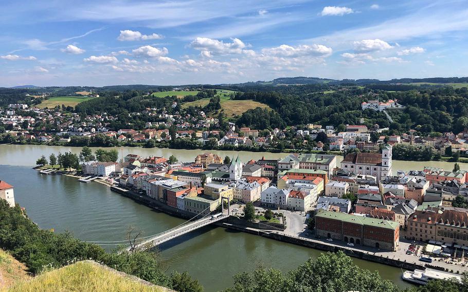 A panorama of Passau's as seen from the fortress overlooking the confluence of the Danube and Inn rivers. The waters of the Danube are darker, while those of the Inn are a lighter shade of green.