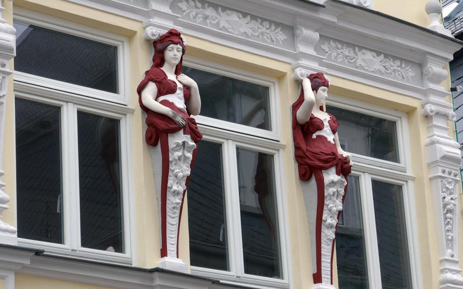 Two female art nouveau figures adorn Haus Colditz, an early 19th century building in the center of Kastellaun, Germany. Today it houses the town's tourist information office.