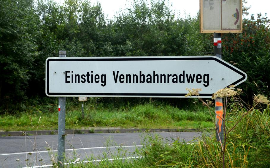 A sign near the cloisters at Reichenstein, Germany, points to the Vennbahn bike path, with free parking. The 77-mile path runs from Aachen, Germany, in the north to Troisvierges, Luxembourg, in the south, criss-crossing the German-Belgian border numerous times on the way.