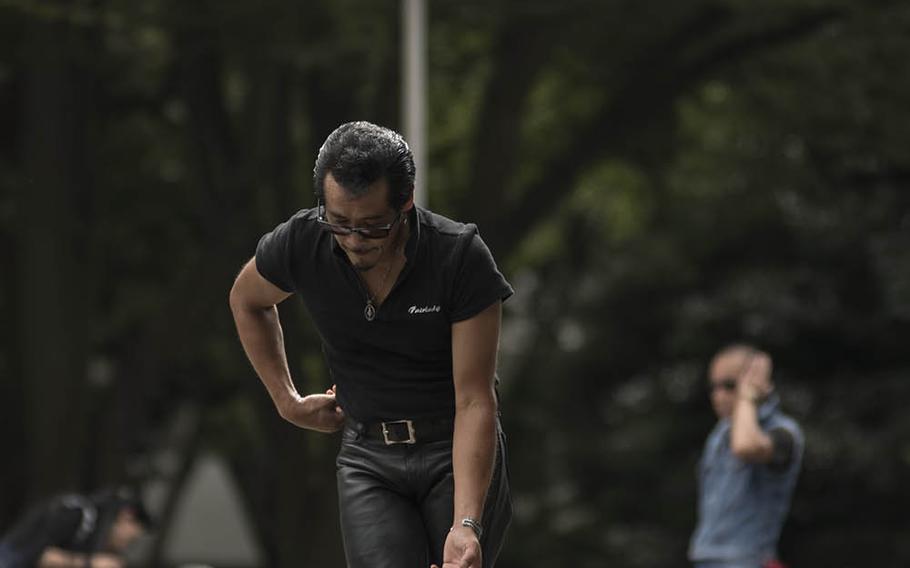 Tokyo's iconic Rockabilly dancers perform outside Yoyogi Park, Sept. 6, 2020. The dancers gather here every Sunday in their blue jeans and boots to twist and strut to classic rock 'n' roll tunes.