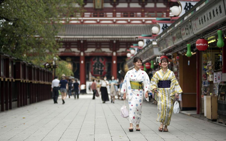 Tourists visit Sensoji, a popular Buddhist temple in the Asakusa district of central Tokyo, Sept. 1, 2020.