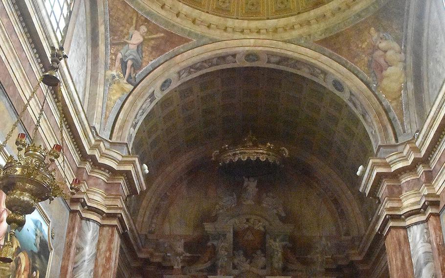 The church of Santa Maria Maggiore in Dardago, Italy, has one of the more colorful interiors among local churches, with much of it painted yellow and a plethora of artwork around the altar.