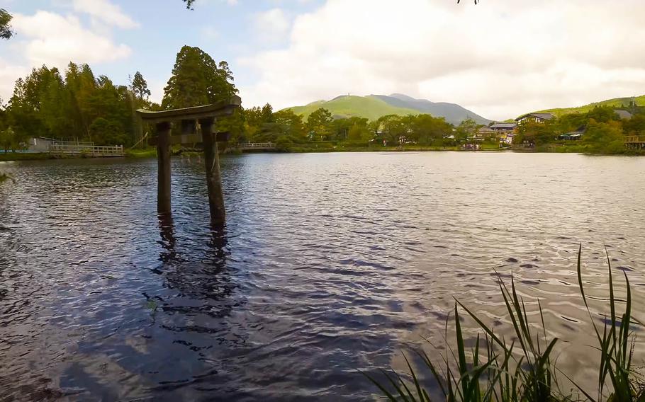 YouTuber Rambalac finds a submerged Torii Gate at Kinrin Lake while walking around Kyushu, Japan, in this screenshot from one of his "Videowalks" from 2019.