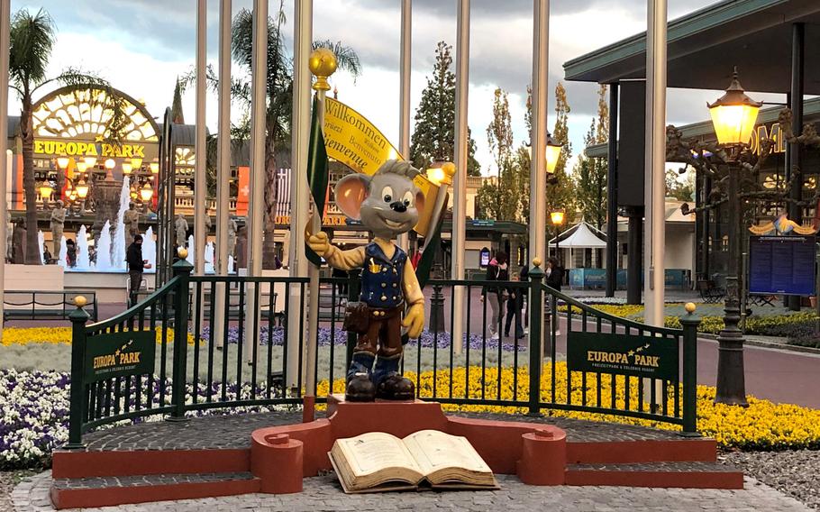 A statue of Europa Park's mascot Ed Euromaus stands at the entrance to the park.