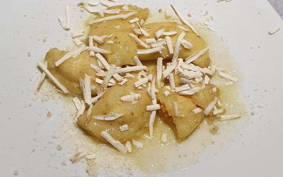 Eating the pumpkin ravioli, one of the first course offerings at Bar Trattoria Cavour in Sacile, Italy, was like biting into a little cloud of happiness, my wife said.