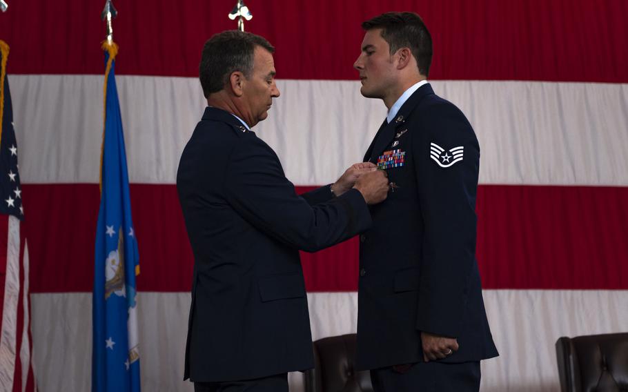Air Force Maj. Gen. Chad P. Franks, commander of the 15th Air Force, pins a Silver Star Medal to the chest of Staff Sgt. Nicholas Brunetto, a pararescueman with the 38th Rescue Squadron, during a ceremony at Moody Air Force Base, Ga., on Oct. 29, 2020.