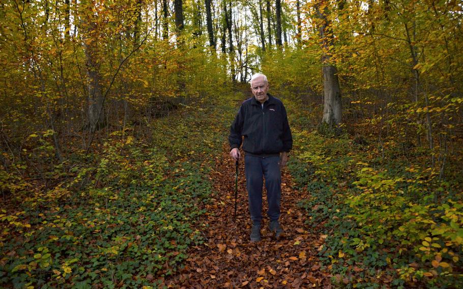 Edgar Becker, 85, makes his way down a steep, slippery part of the Grenzweg hiking trail, which begins and ends in Berus, Germany. The lightly trafficked trail crisscrosses the French-German border and is ideal for getting fresh air and exercise while keeping away from others during the coronavirus pandemic.