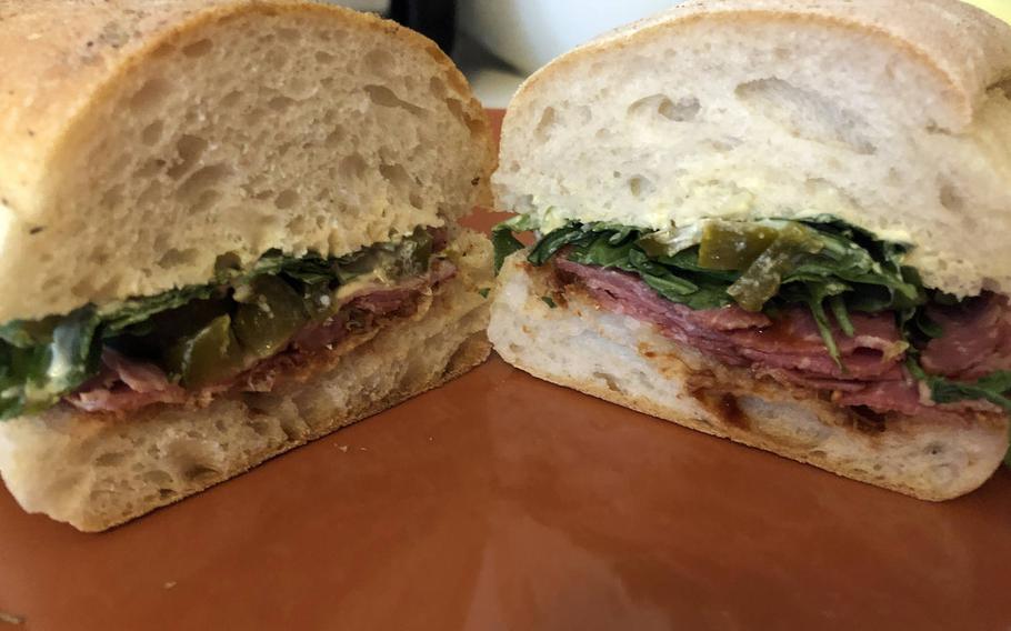 With the partial coronavirus lockdown in Germany, takeout is all that's available at Vinocentral in Darmstadt. This is a panini classico pastrami, with pastrami, barbecue sauce, honey-mustard cream cheese, fresh tomatoes and arugula.