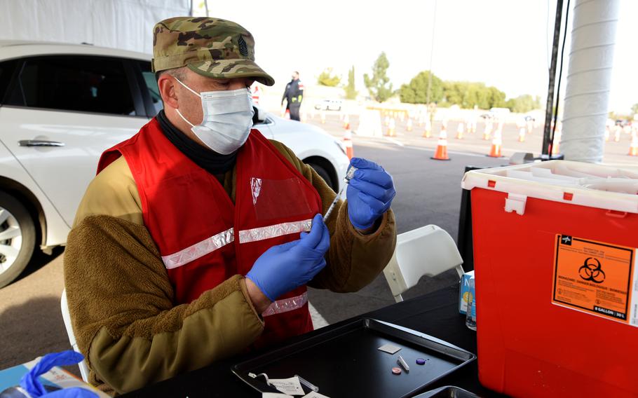 Arizona National Guard Soldiers and Airmen directed traffic, checked in patients, administered the vaccine and out-processed patients at a COVID-19 vaccination site in Chandler, Ariz., Dec. 23, 2020.