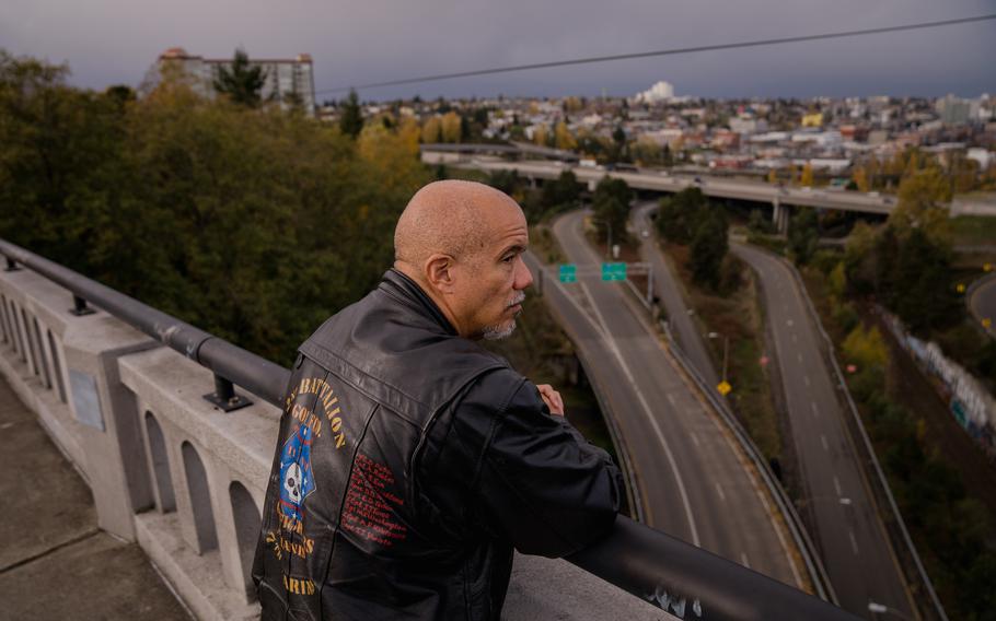 Michael Washington, a combat veteran, stands on the Tacoma, Wash., bridge where he once tried to end his life. Washington is now involved in advocacy work focused on gun safety and veteran suicide. 