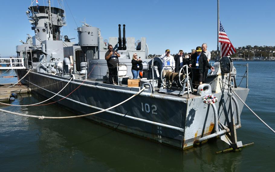 Veteran Ed Desmond tosses a memorial wreath off the back of the USS LCS 102 during the Landing Craft Support Museum 7th Annual Convention Memorial Service on Mare Island on Wednesday, Sept. 30, 2021.