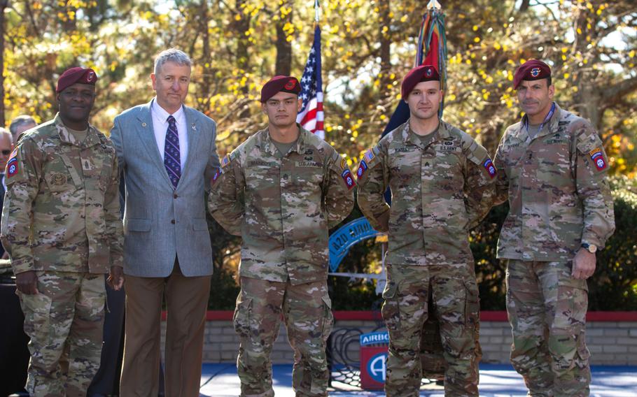 From left, Command Sgt. Maj. David Pitt, Ret. Gen. David Rodriguez, Sgt. 1st Class Christian Mandzy, Sgt. Aaron Kindle and Maj. Gen. Christopher Donohue attend an awards ceremony at Fort Bragg on Nov. 19, 2021.