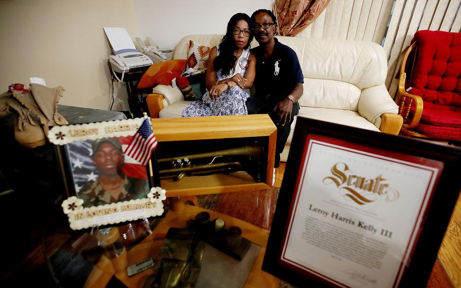 Guiselle and Leroy Harris Jr., the parents of Leroy Harris III, with mementos of their son, including his combat boots, citations, an old trumpet and pictures. A soldier in the U.S. Army, Leroy Harris III was killed in action in 2004 in Iraq. 