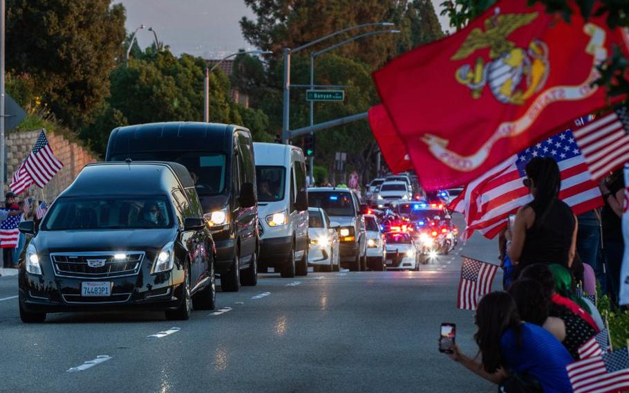 The funeral procession for Marine Lance Cpl. Dylan Merola, who was killed in the Kabul airport attack last month, passes his alma mater, Los Osos High School in Rancho Cucamonga on Tuesday, Sept. 21, 2021.