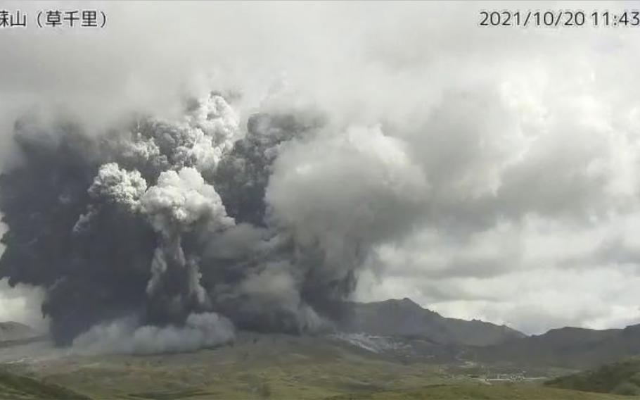 In this image taken by a surveillance camera released by Japan Meteorological Agency, smokes rise from the No. 1 Nakadake crater of Mr. Aso after its eruption, observed from Kusasenri, southwestern Japan, Wednesday, Oct. 20, 2021. The eruption occurred at 11:43 a.m., according to the agency.