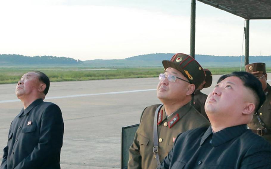 This image from the Korean Central News Agency shows North Korean leader Kim Jong Un and other officials observing a missile test in September 2017. 