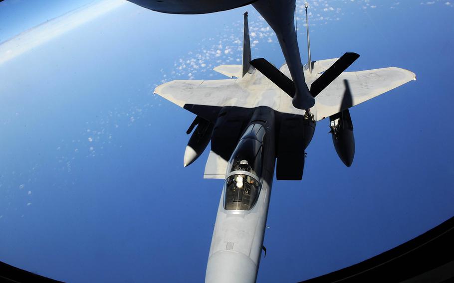 An F-15C Eagle from Kadena Air Base, Japan, receives fuel from a KC-135 Stratotanker during the Forceful Tiger exercise over the Pacific Ocean on Wednesday, April 1, 2015.