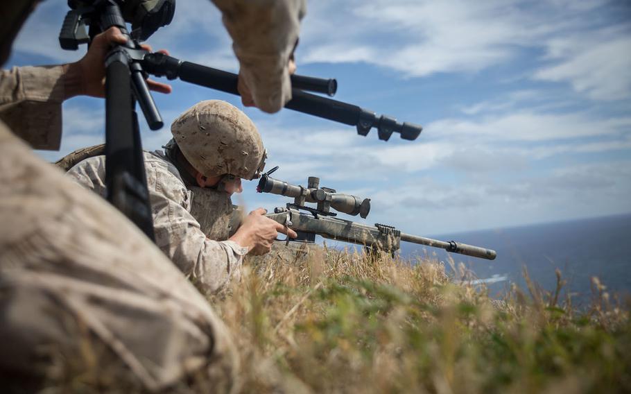 Marines with weapons company 2nd Battalion 3rd Marine Regiment fire the M40 sniper rifle and M110 Semi-Automatic Sniper System at varying targets over 800 meters at Ulupa?u Crater April 8, 2015.