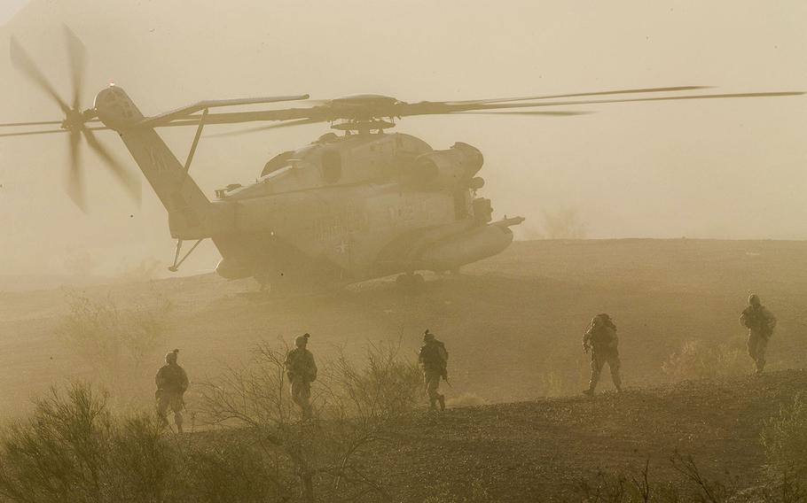 U.S. Marines with 1st Battalion, 5th Marine Regiment, 1st Marine Division participate in a heavy Huey raid during Weapons and Tactics Instructor Course 2-15 at K-9 Village, Yuma Proving Grounds, Ariz., April 8, 2015.