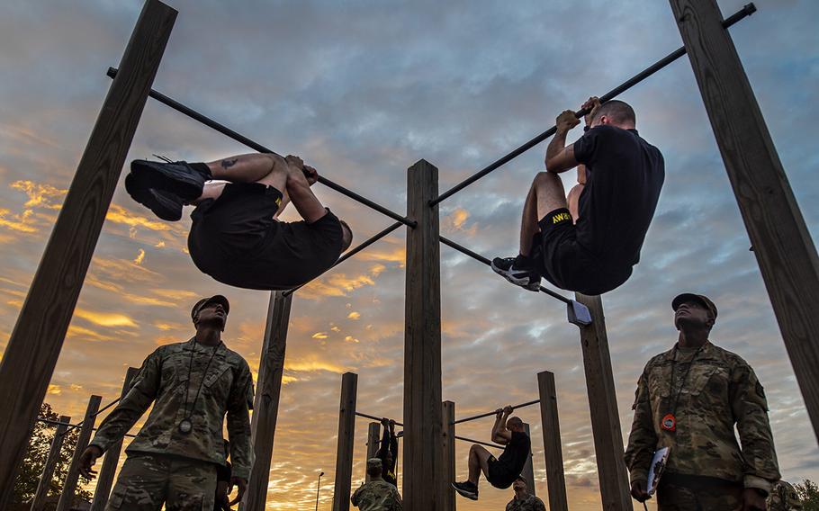 The top command sergeants major from across the U.S. Army Reserve perform the leg tuck for a practice Army Combat Fitness Test at Fort Eustis, Va., on Oct. 25, 2019, during the Army Reserve Senior Enlisted Council.