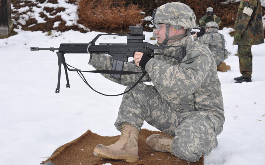 Spc. Jake Altman eyes his target while competing for the German proficiency badge at the German Infantry School in Hammelburg, Germany, in February.