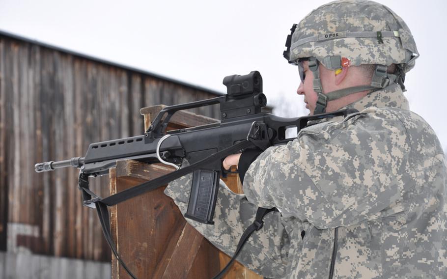 Spc. Jake Altman aims at his target while competing for the German proficiency badge at the German Infantry School in Hammelburg, Germany, in February.