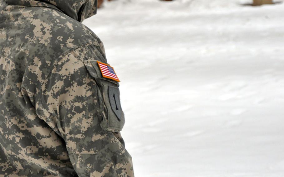 Spc. Jake Altman fires a pistol at a German firing range in February.
