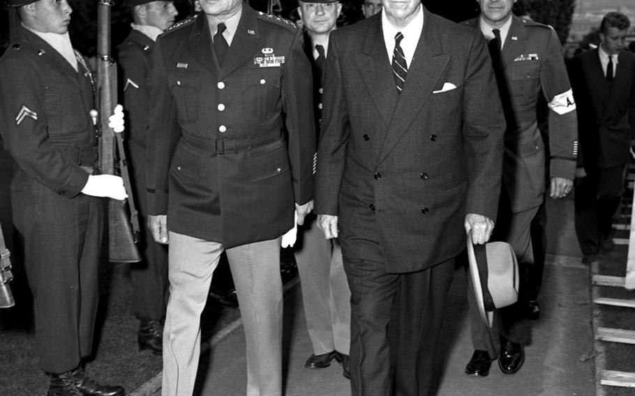 Gen. Matthew Ridgway, Supreme Allied Commander, Europe, and Gen. George C. Marshalll, former Secretary of State and Secretary of Defense and then-chairman of the U.S. Battle Monuments Commission, arrive at the dedication ceremony for the first memorial in an overseas cemetery to fallen World War II U.S. servicemembers at Suresnes, France, on September 13, 1952.
