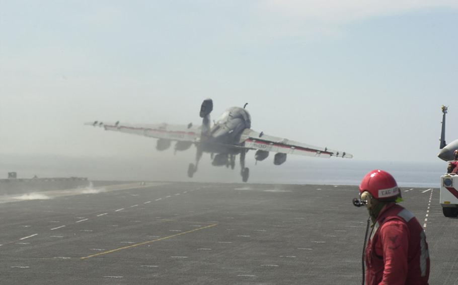A Prowler aircraft takes off Sunday from the deck of the USS George Washington during the Invincible Spirit exercise now underway in the Sea of Japan. 
