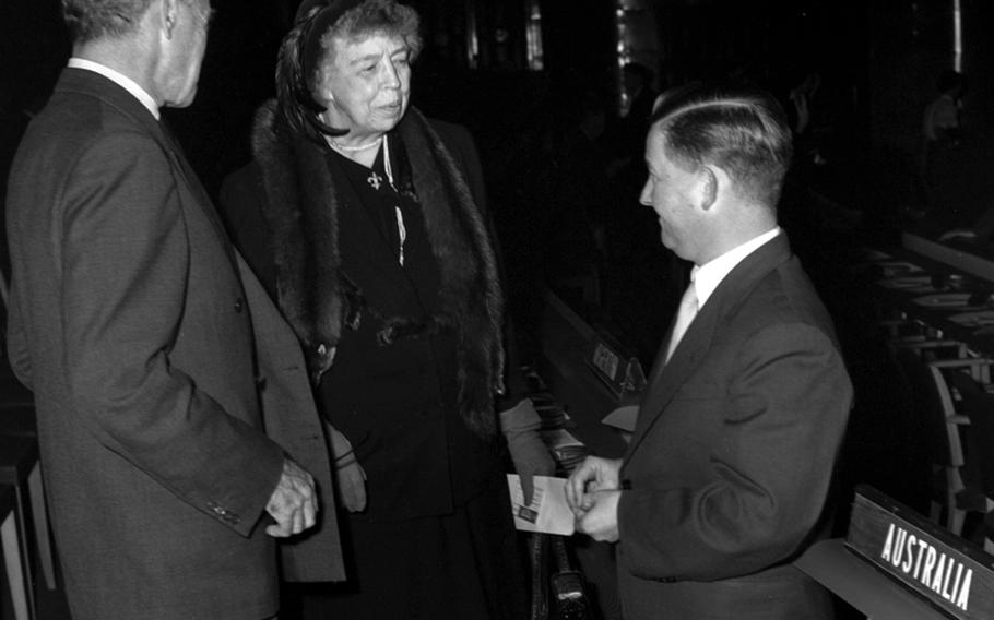 Former first lady Eleanor Roosevelt, a U.S. delegate to the General Assembly, talks with two Australian representatives.