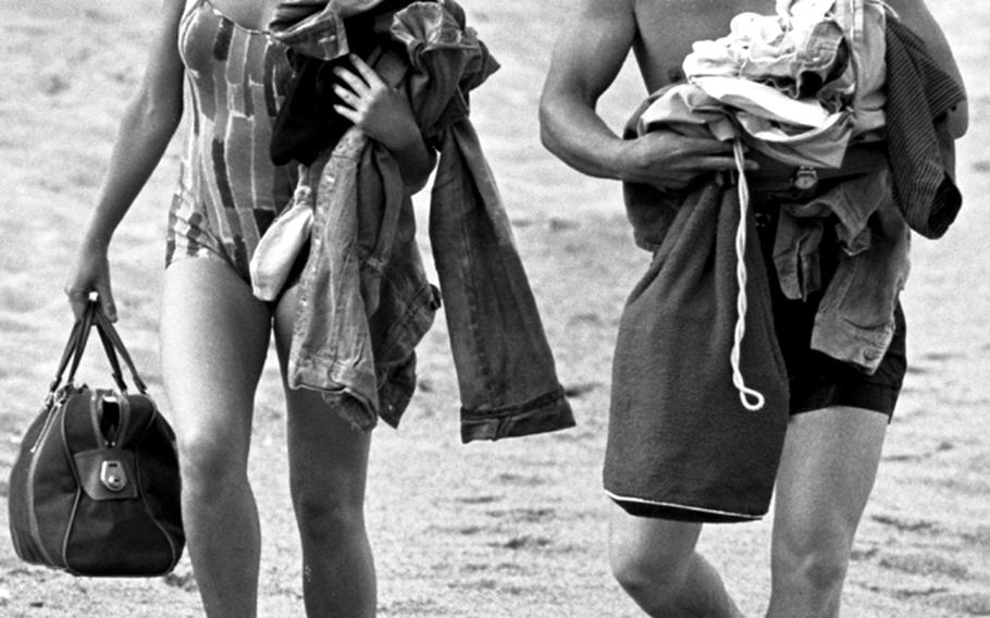 Hayley Mills and James MacArthur walk along the beach on Spain's Costa Brava during the filming of "The Truth about Spring" in 1964.