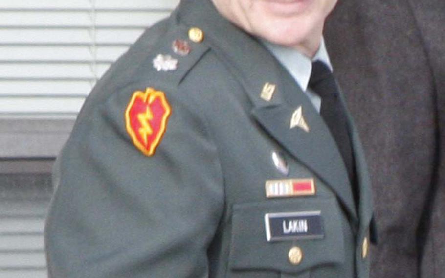 Lt. Col. Terrence Lakin leaves the courthouse at Fort Meade, Md., during the first day of his court-martial Tuesday. Lakin refused to deploy to Afghanistan last spring, claiming that the order was not valid because Barack Obama's presidency may not be legitimate due to claims he is not an American-born citizen.