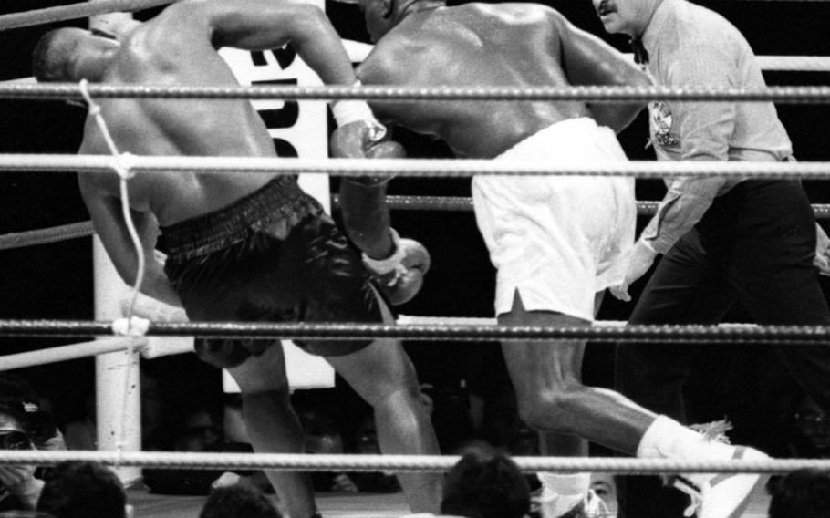 James "Buster" Douglas finishes off Mike Tyson in the 10th round of their fight at the Tokyo Dome.